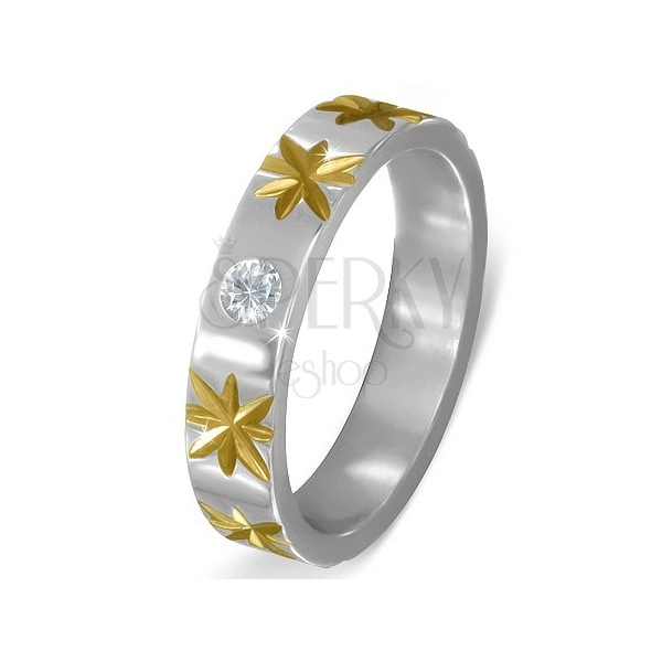 Oceľový prsteň striebornej farby s hviezdami zlatej farby a čírym zirkónom