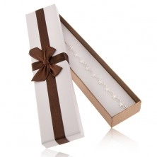 Podlhovastá krabička na náramok a retiazku, biela a bronzová farba, mašľa