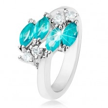 Lesklý prsteň striebornej farby, modré zirkónové zrnká, číre zirkóniky