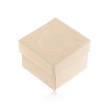 Darčeková krabička v béžovom odtieni, ornamenty a nápis zlatej farby