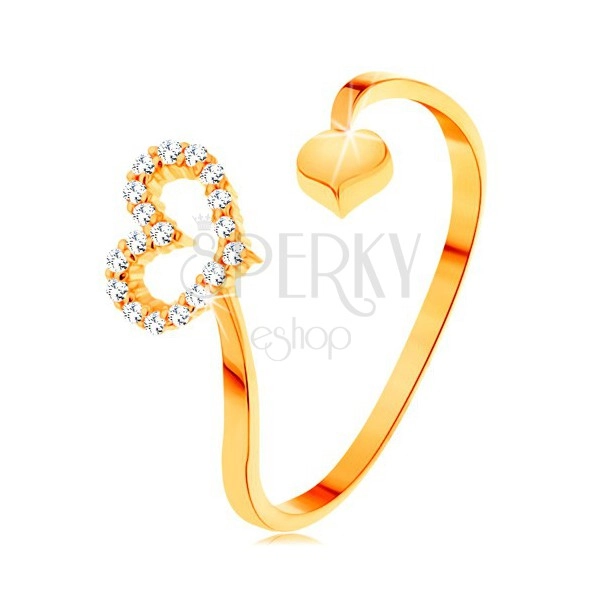 Zlatý prsteň 585 - zvlnené ramená ukončené obrysom srdca a plným srdiečkom