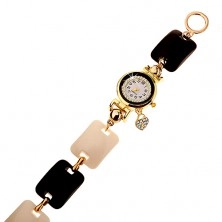 Čierno-biele náramkové hodinky, vypuklé obdĺžniky, ciferník s čírymi zirkónmi