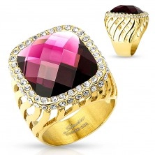 Mohutný oceľový prsteň zlatej farby, veľký fialový zirkón s čírou obrubou, výrezy