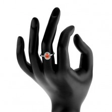 Strieborný prsteň 925, tmavo oranžový oválny zirkón, číry ligotavý lem