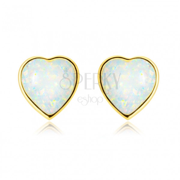 Zlaté 14K náušnice - pravidelné srdce s vypuklým syntetickým bielym opálom, puzetky